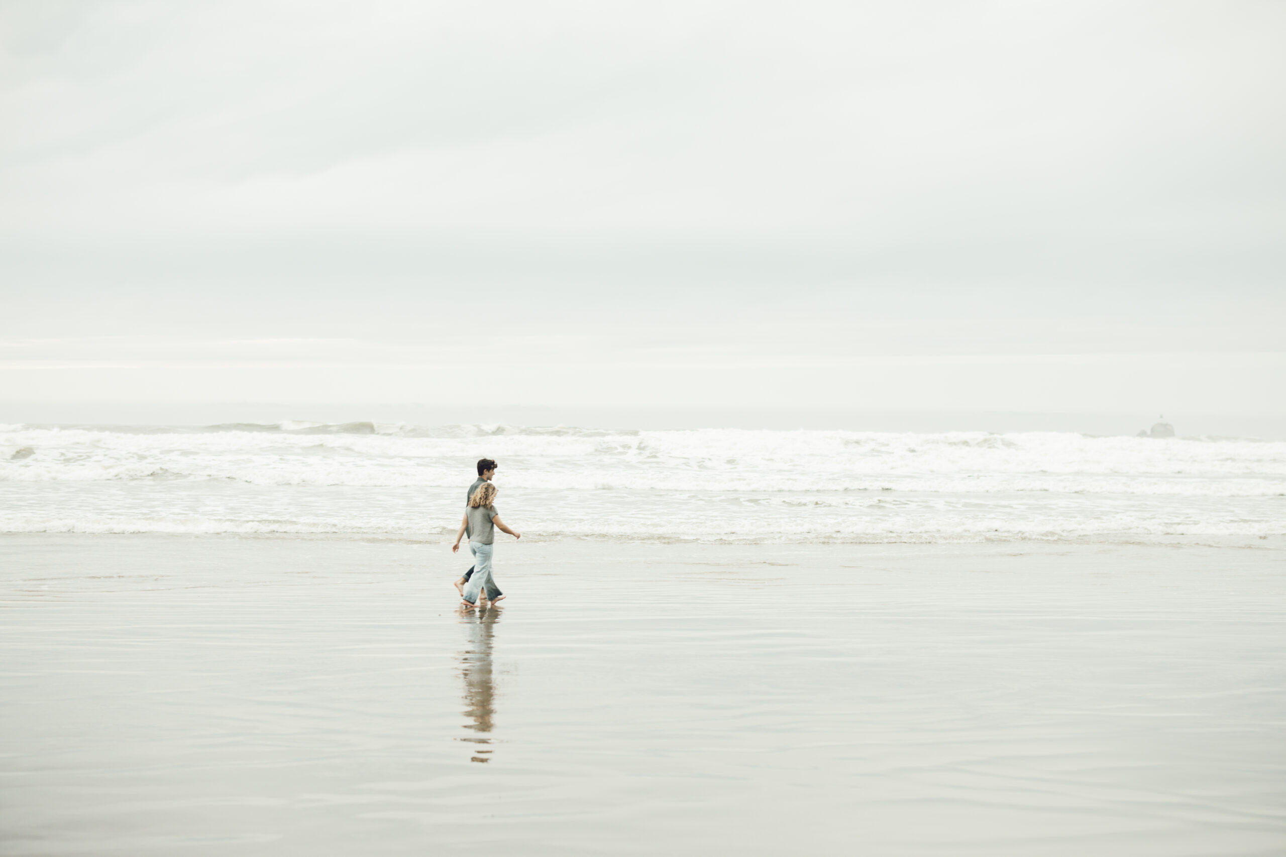 Engagement photography on the Oregon coast, couple walking